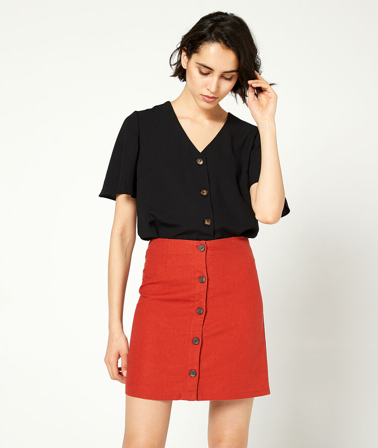 Blouse unie à boutons noir.