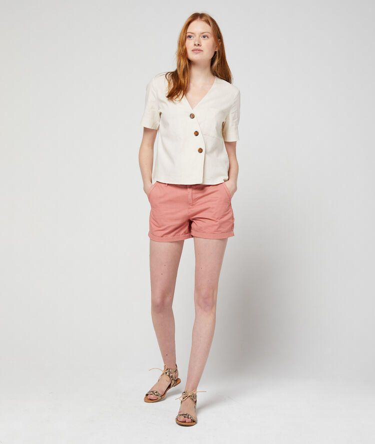 Blouse courte boutonnage asymétrique beige.