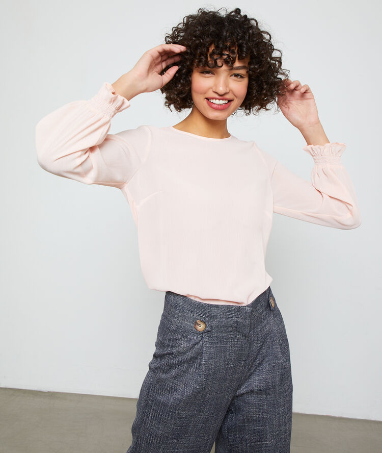 Blouse boutonnée au dos nude.