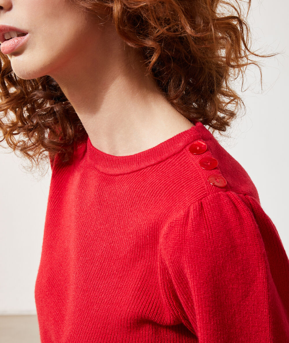 Pull manches ballon rouge.