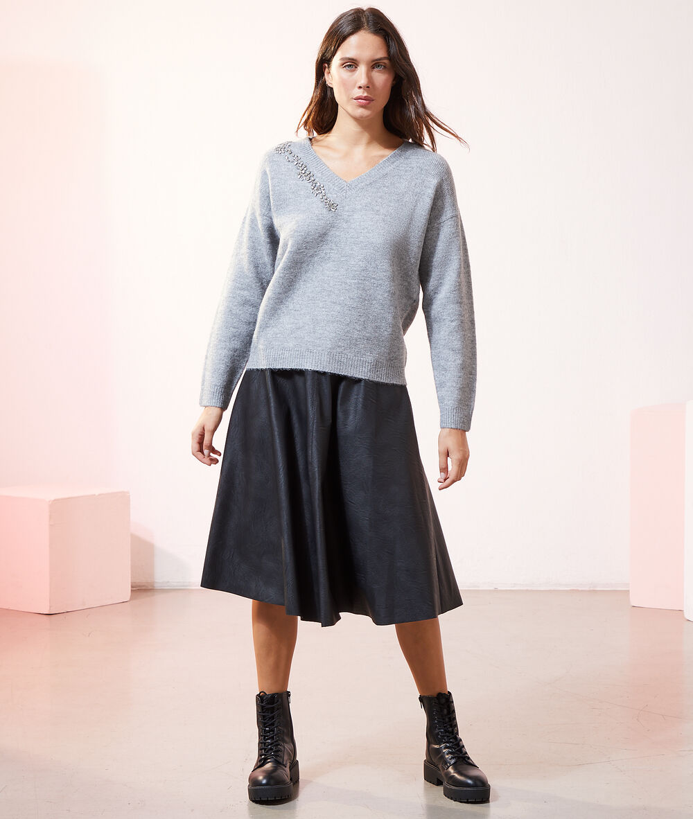 Jupe midi effet cuir noir.