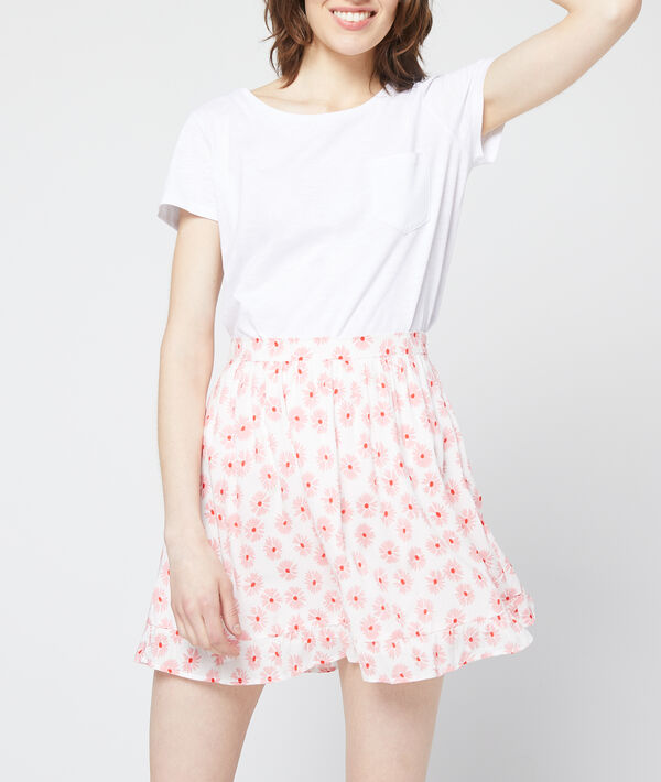 Jupe patineuse à imprimé fleuri rose pale.