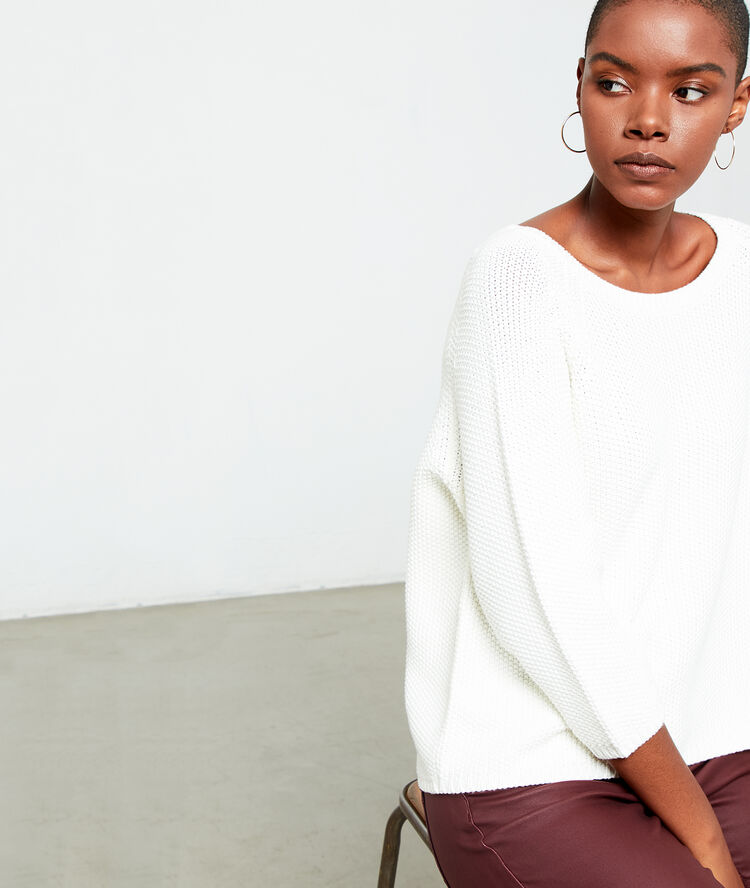Pull en grosse maille creme.