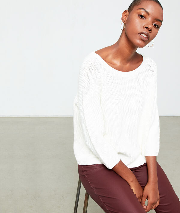 Pull en grosse maille creme.