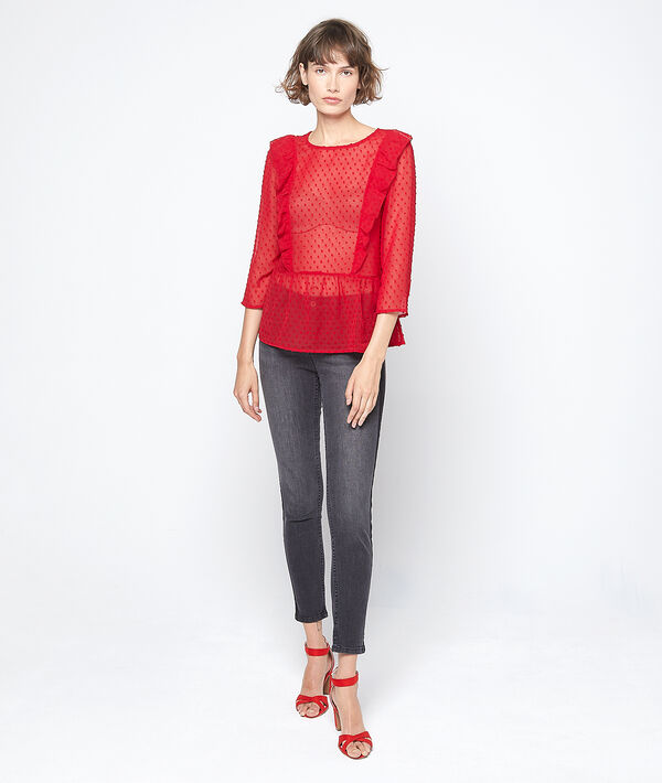 Blouse transparente en plumetis rouge.
