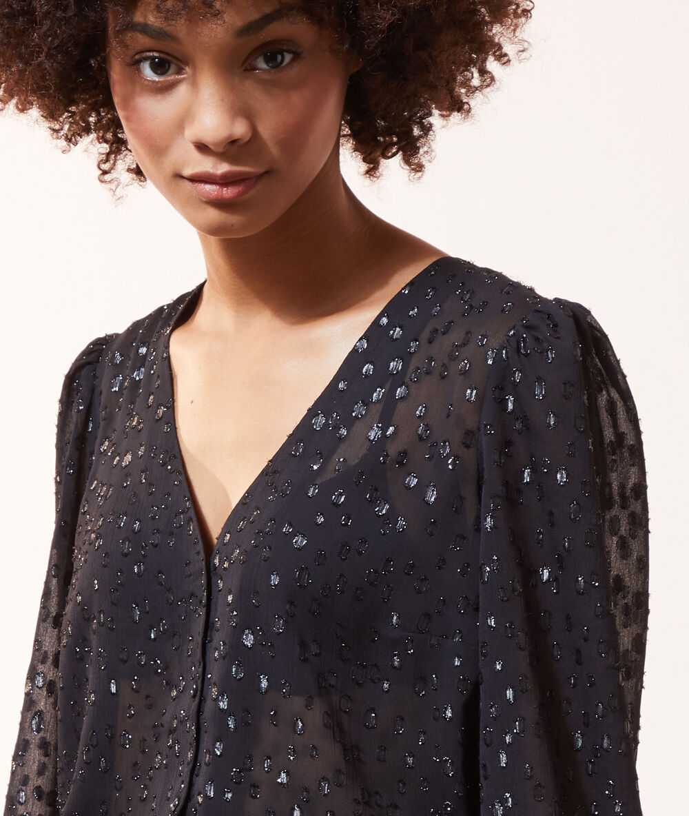 Chemise transparente pailleté manches ballon noir.