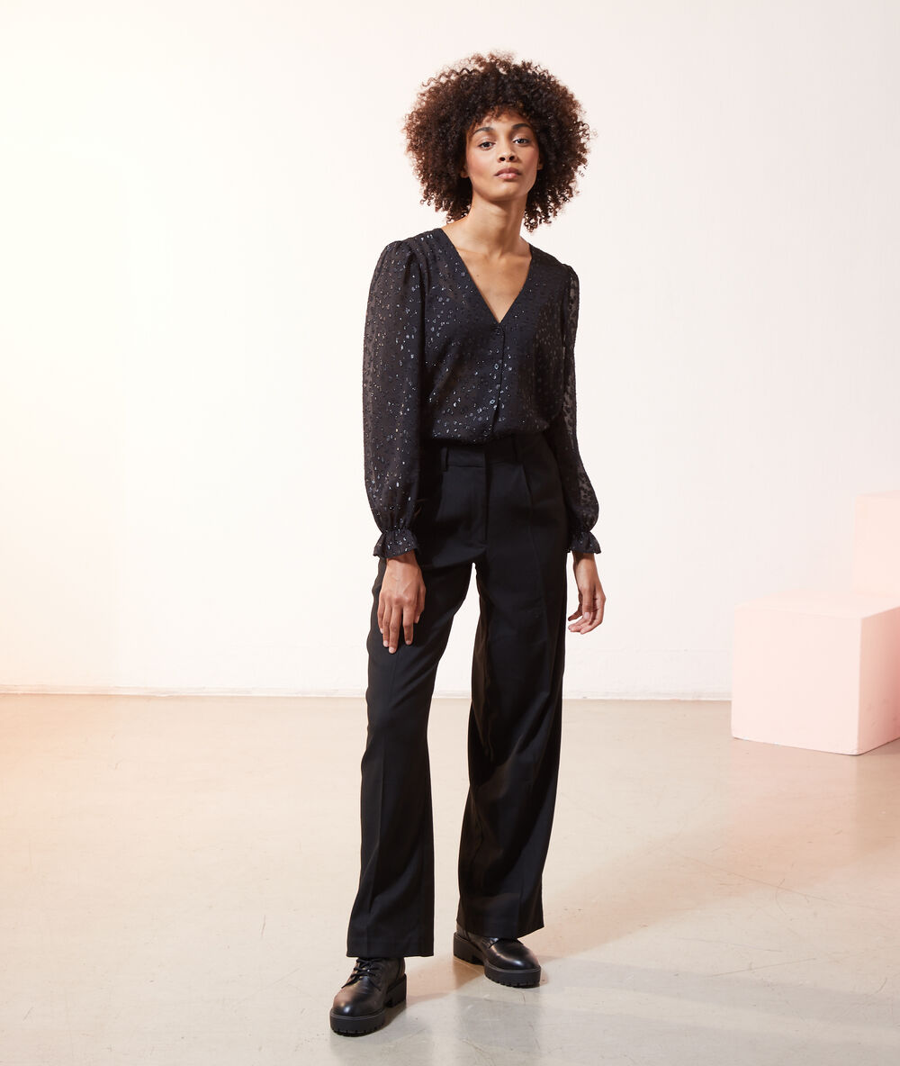 Pantalon large à pinces noir.