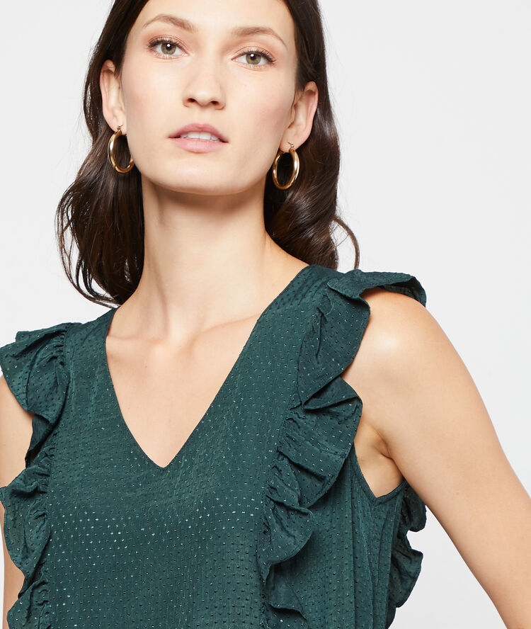 Blouse plumetis à volants canard.