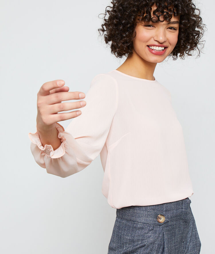 Blouse boutonnée au dos nude.