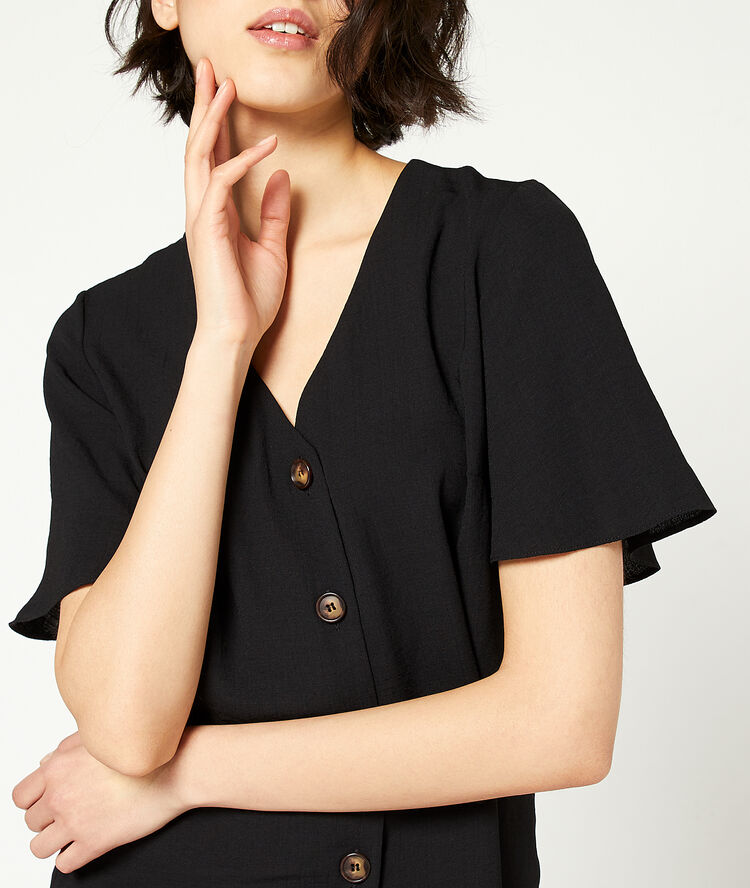 Blouse unie à boutons noir.