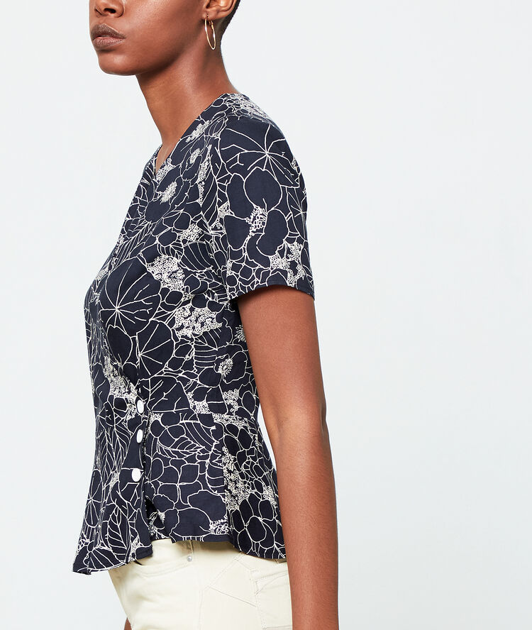 Blouse cache-coeur à imprimé fleuri noir.