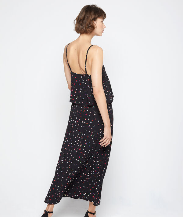 Robe longue nouée à volants noir.