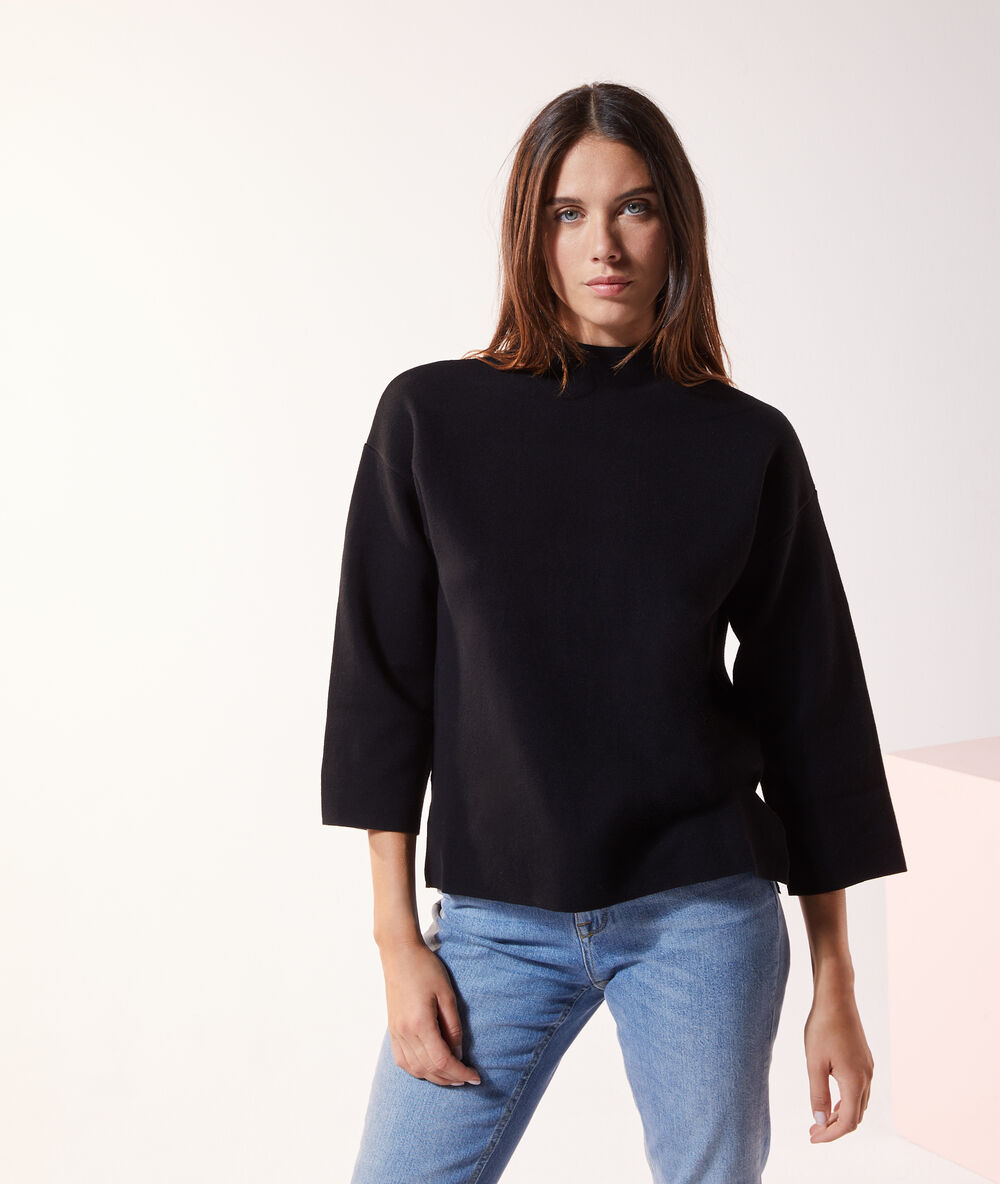 Pull col montant noir.