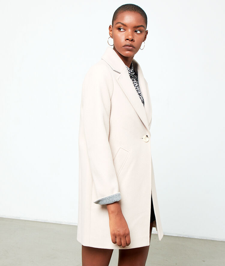 Manteau droit creme.
