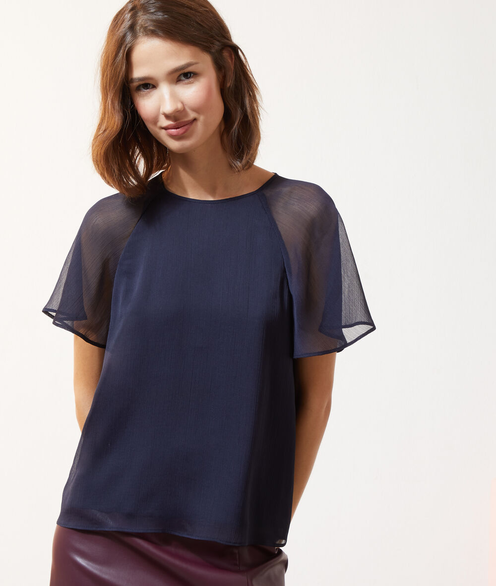 Blouse nouée dans le dos bleu marine.