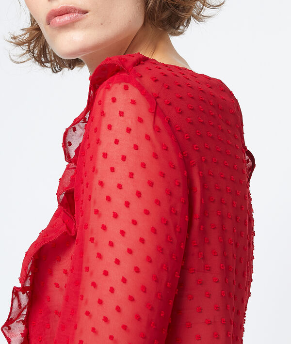 Blouse transparente en plumetis rouge.