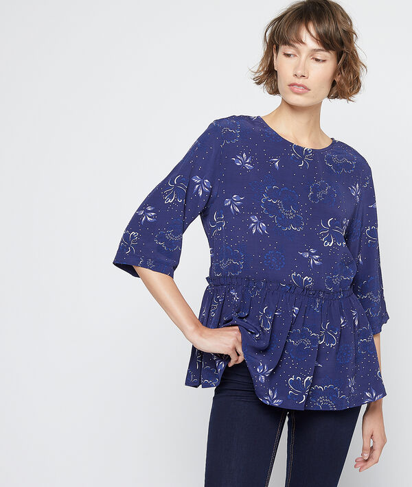 Blouse à basque volantée marine.