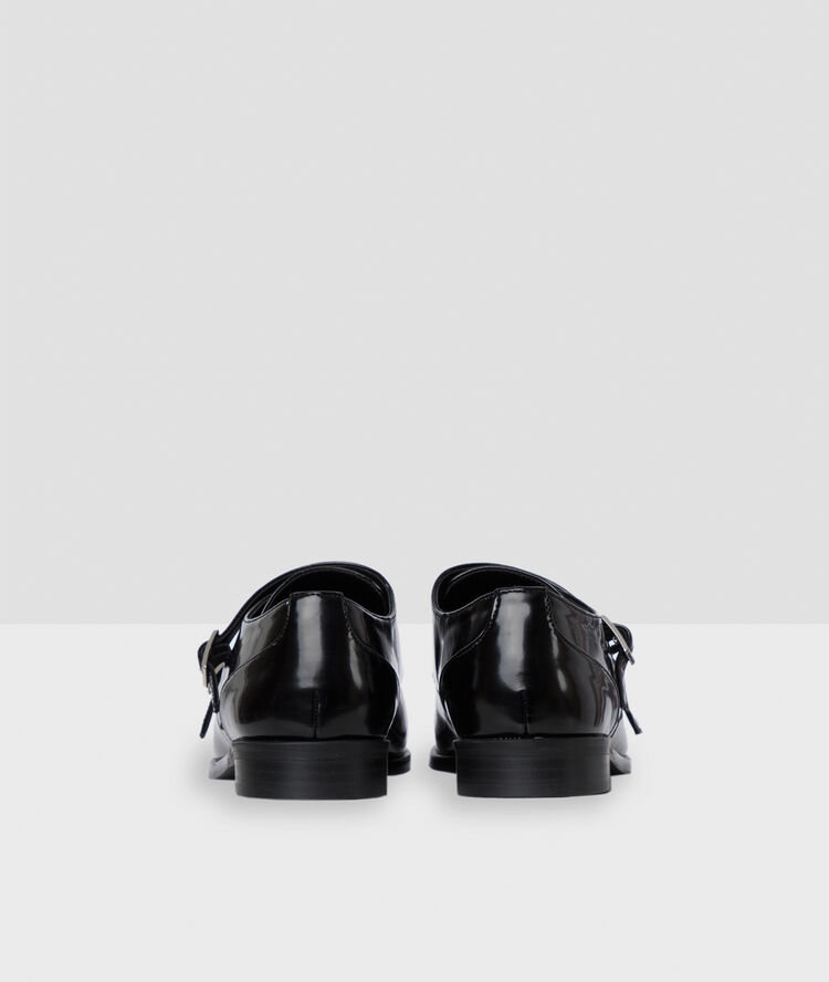 Derbies vernies à boucles noir.