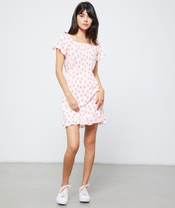 Robe à imprimé fleuri rose pale.