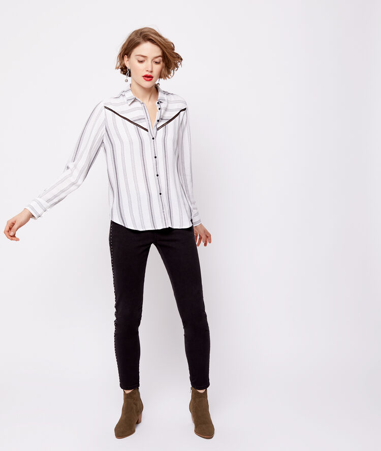 Pantalon slim à clous noir.
