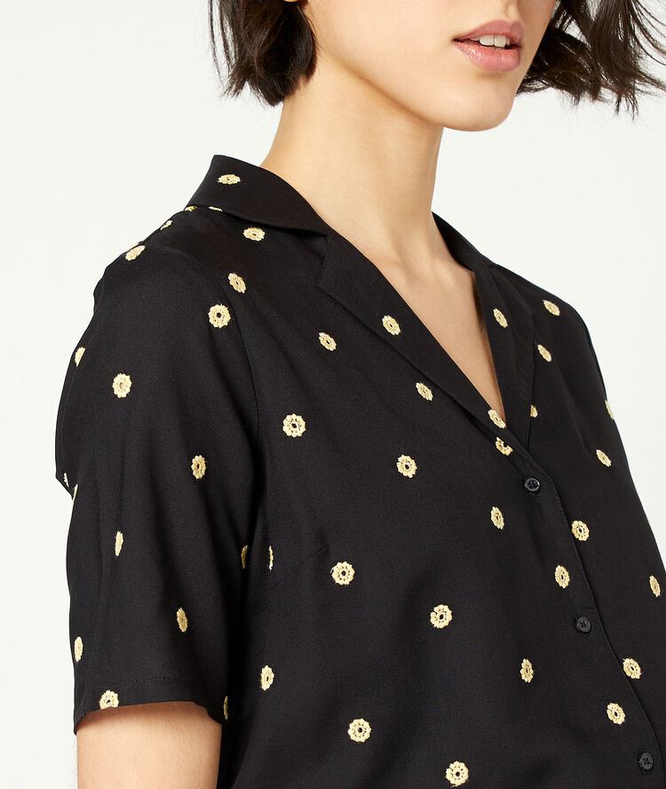 Blouse à imprimé fleuri noir.