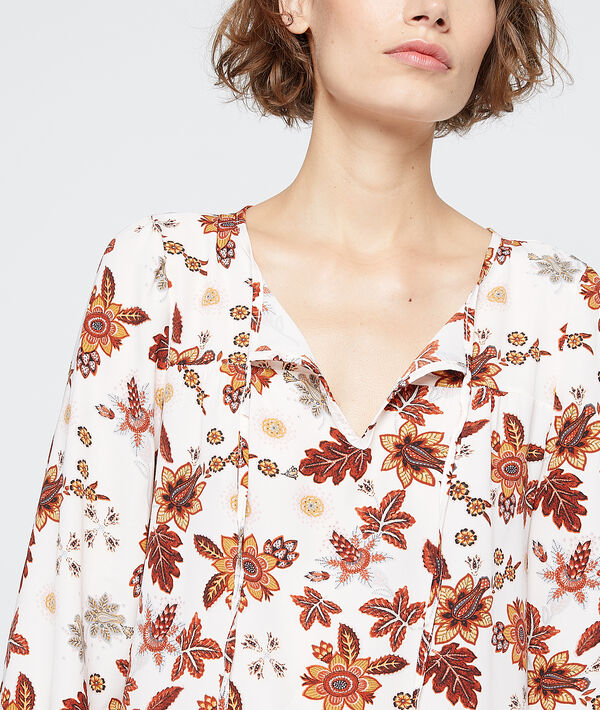 Blouse à imprimé floral ecru.