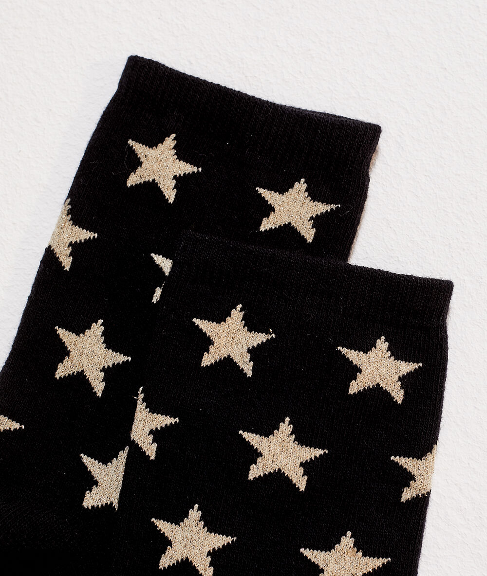 Chaussettes étoiles à fils métallisés noir.