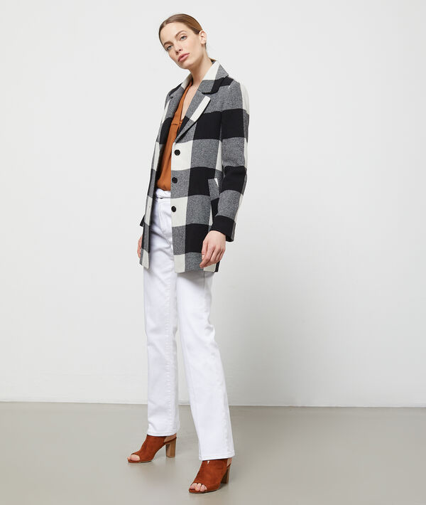 Pantalon flare ceinturé blanc.
