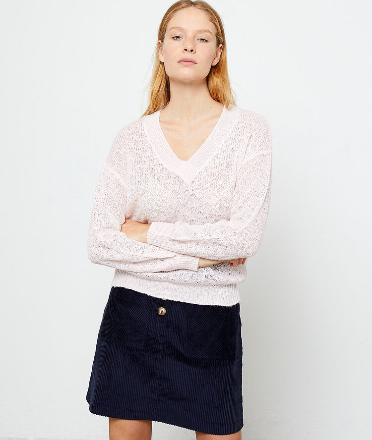 Pull en maille pointelle nude.