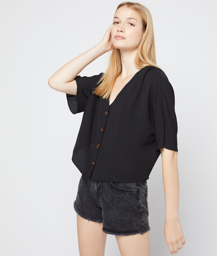 Short en jean à bords frangés noir.