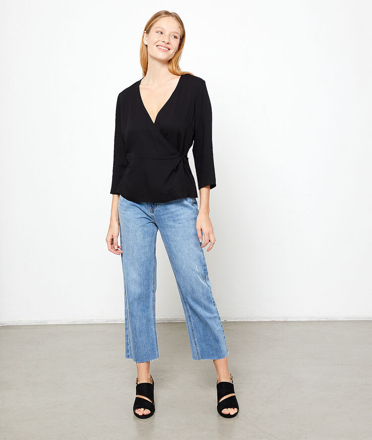 Blouse cache-coeur noir.