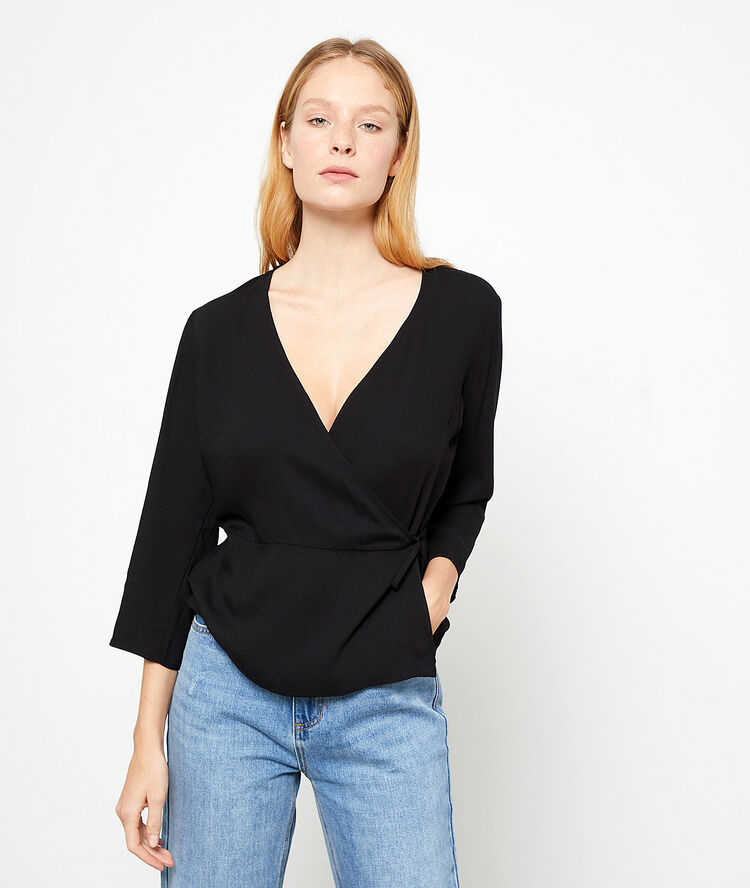 Blouse cache-coeur noir.