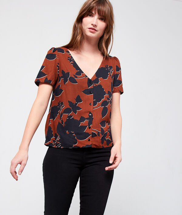 Blouse à imprimé fleuri marron.