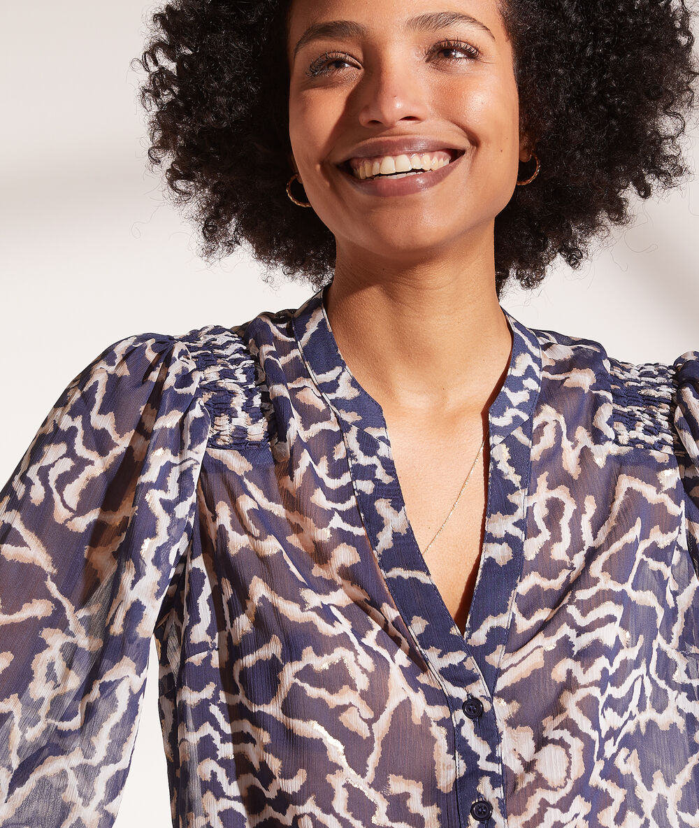 Chemise transparente manches ballon bleu marine.