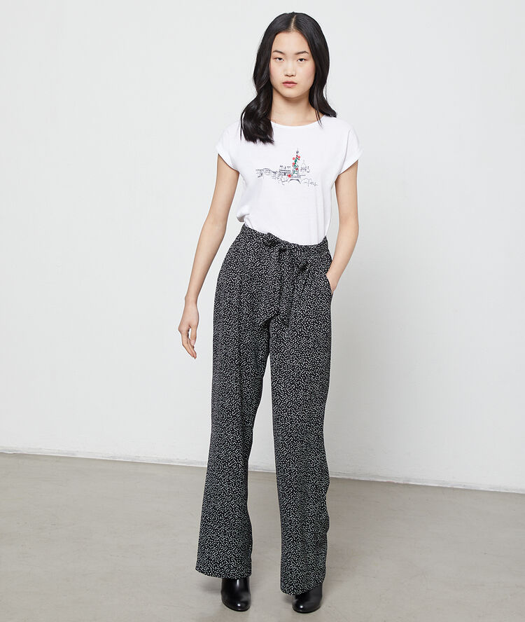 Pantalon large à motifs coeur noir.