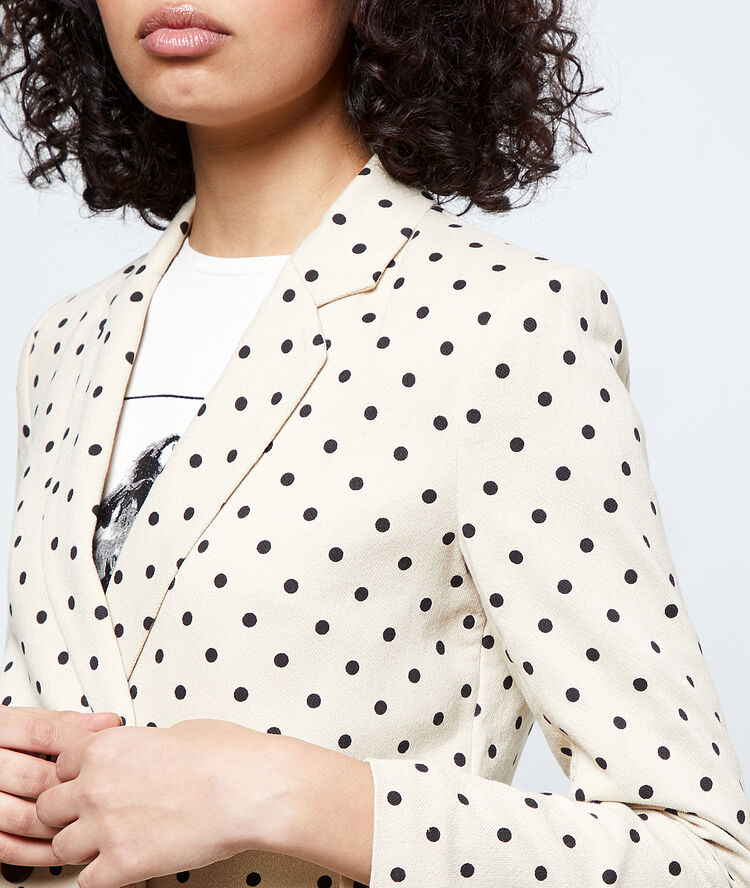 Veste de tailleur à pois ecru.
