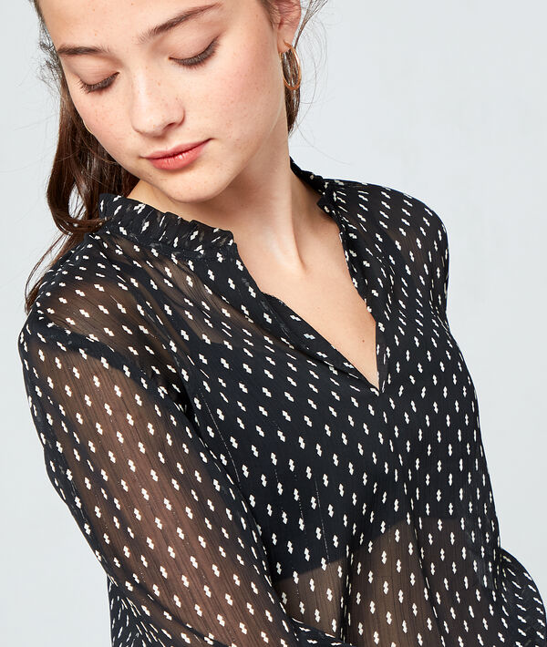 Blouse à pois en transparence noir.