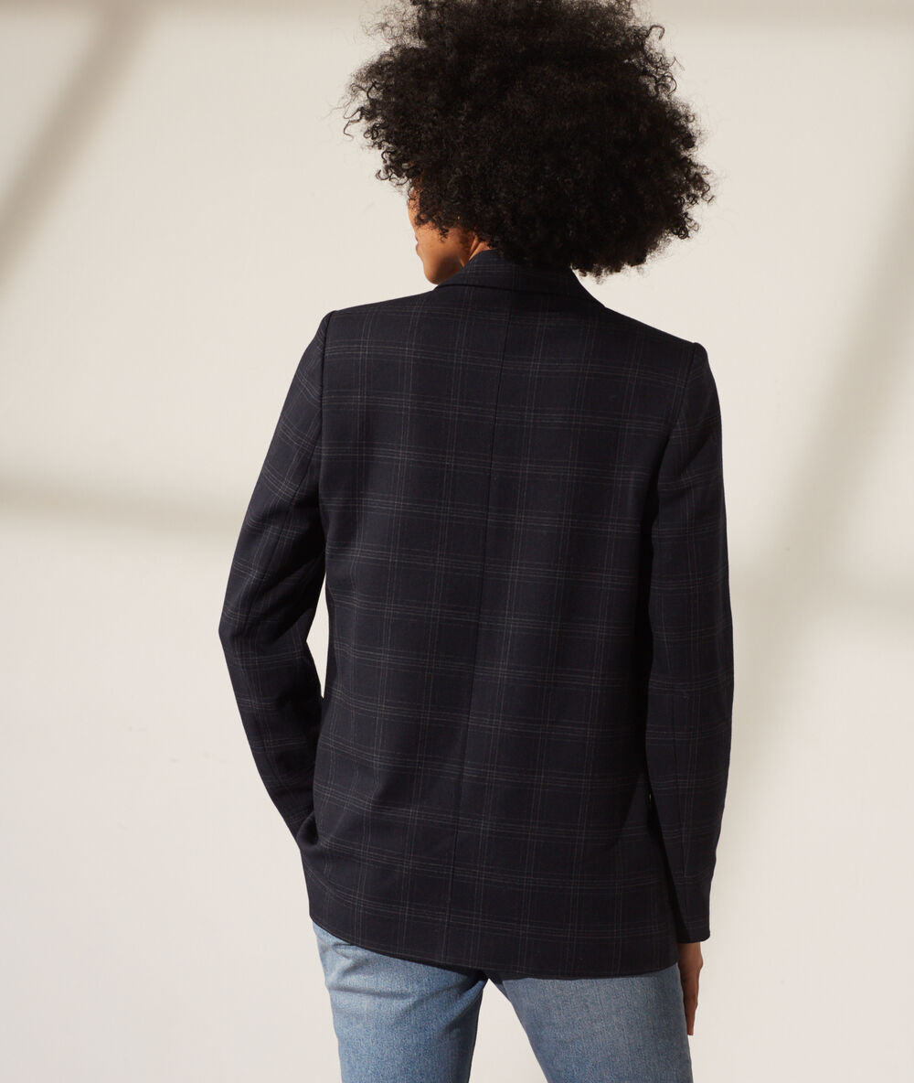 Veste de tailleur à carreaux bleu marine.