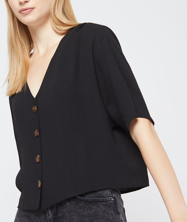 Blouse col v à boutons noir.