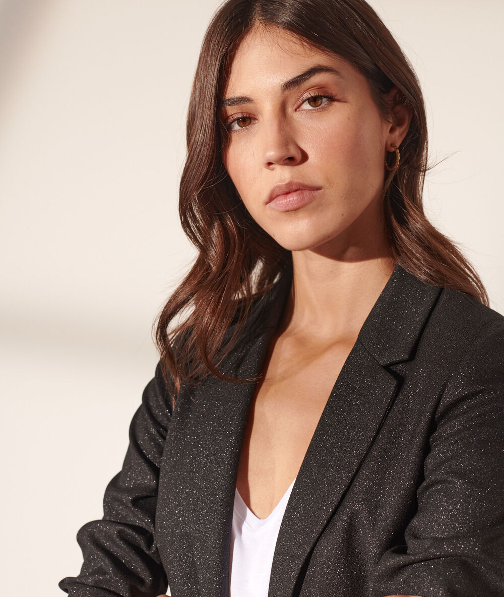 Veste de tailleur pailletée noir.