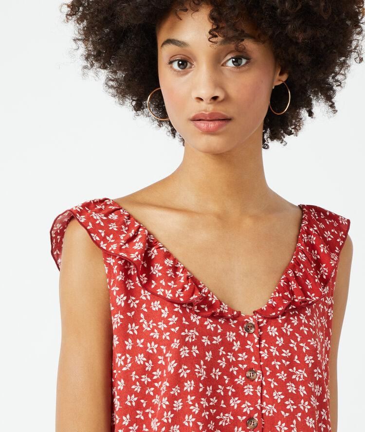 Blouse imprimée à volants brique.