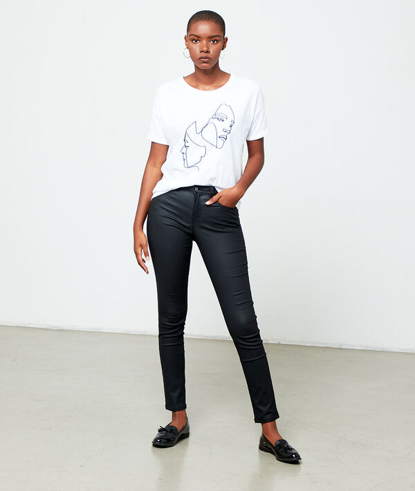 Jean slim enduit noir.