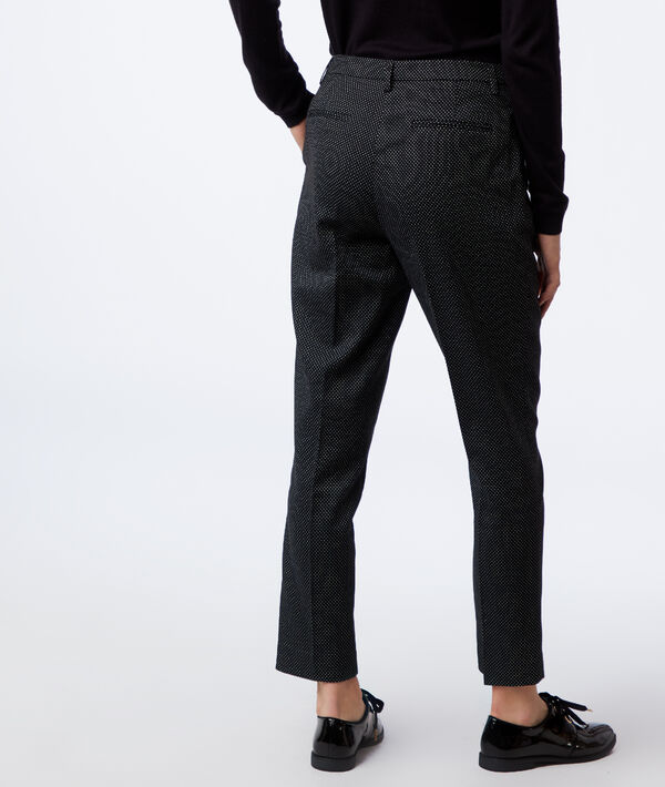 Pantalon cigarette à motifs jacquard noir.