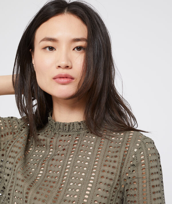 Blouse ajourée en guipure kaki.