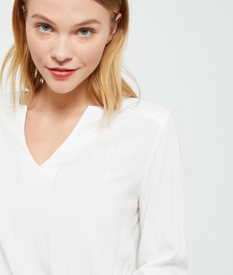 Blouse unie ecru.