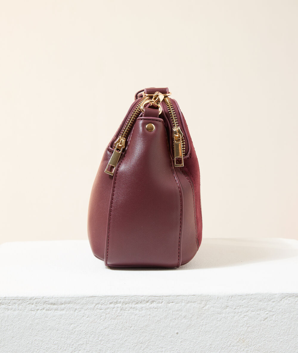 Sac besace bi-matière bordeaux.